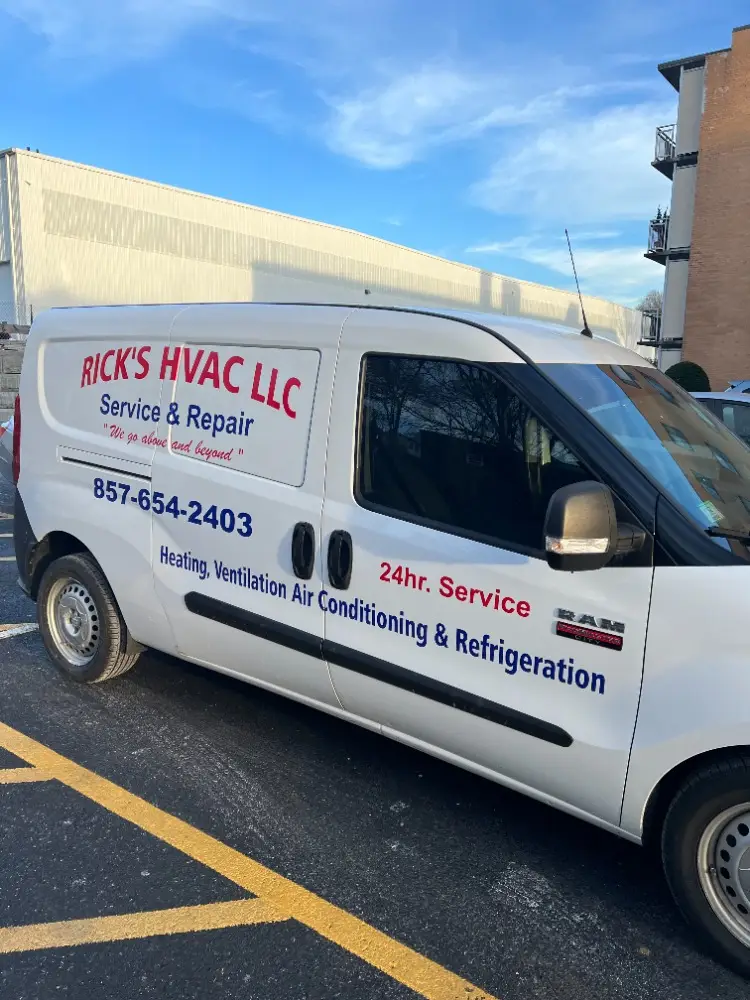 White HVAC service van with company signage