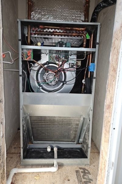 Exposed furnace air handler with blower wheel