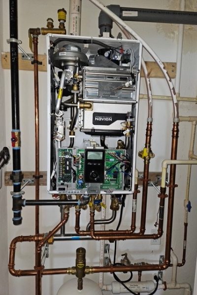 Open tankless water heater with copper piping