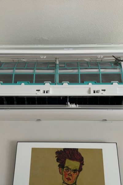 Wall-mounted air conditioner with open filter