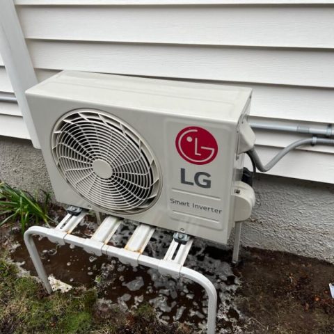 LG outdoor air conditioning unit on stand