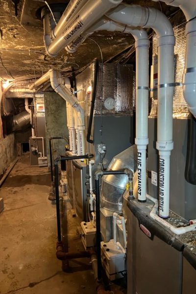 A bunch of pipes that are in the middle of a room